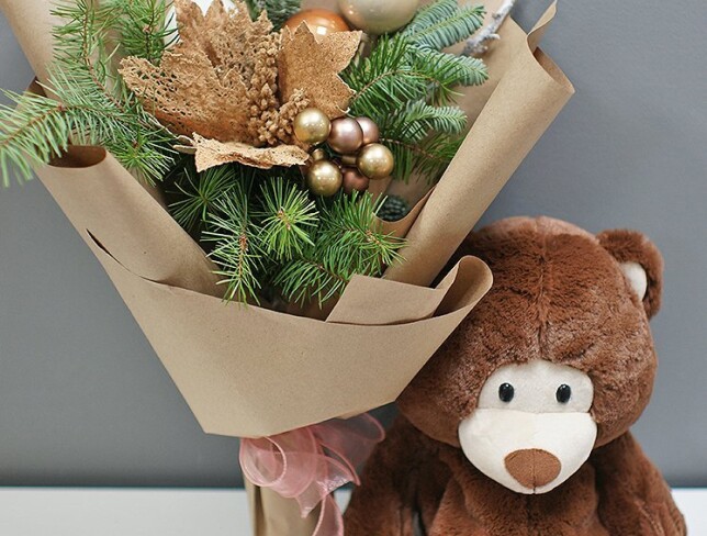 New Year bouquet of ornaments and tree, and a bear gift with candies photo